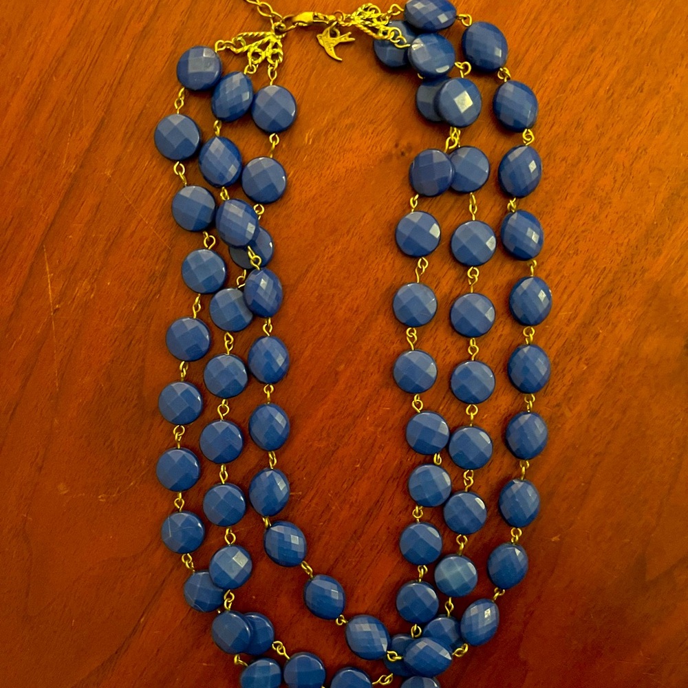 Towne & Reese blue necklace with gold clasp.